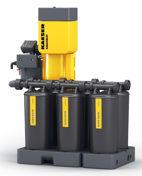 A Kaeser Aquamat condensate treatment unit, its yellow control head feeding a manifold above three filter cartridges on a moulded base.