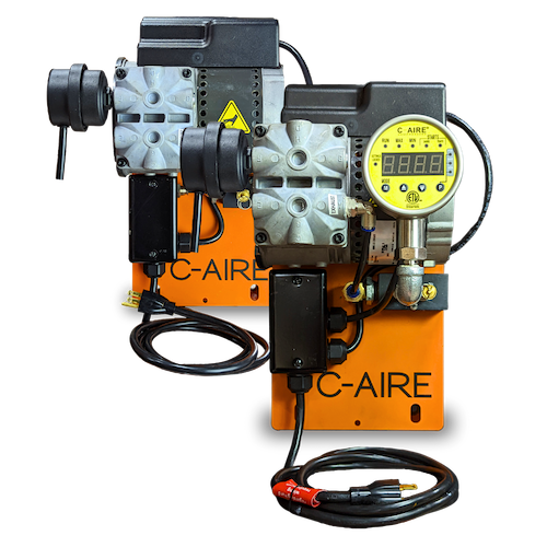 A C-Aire twin-head compressor unit mounted on an orange wall bracket, with a digital controller and power lead.