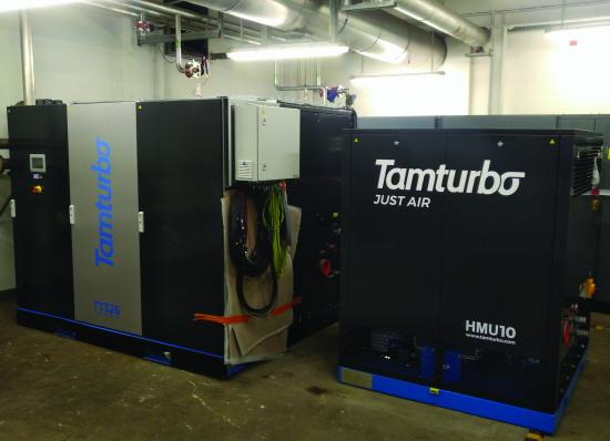 Two Tamturbo compressor packages installed side by side in a plant room.
